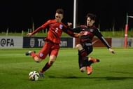 BURTON-UPON-TRENT, ENGLAND - NOVEMBER 18:  Kai Havertz of Germany tackles Jordan Williams of England during the U17s International Friendly match between England U17 and Germany U17 at St Georges Park on November 18, 2015 in Burton-upon-Trent, England. (Photo by Tony Marshall/Getty Images)